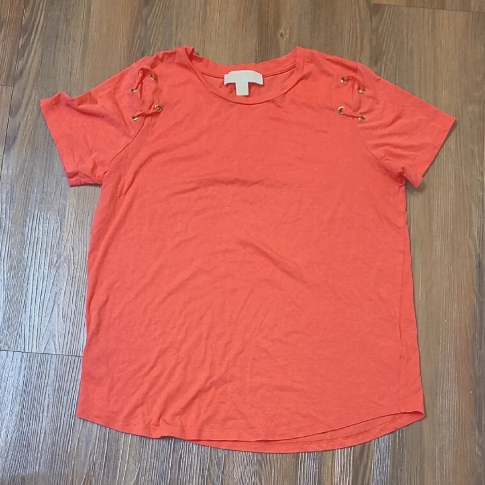 Michael Kors Orange Short Sleeve Top with Lace-Up Detail used good condition‎